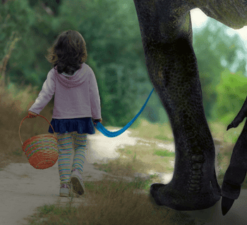 little girl walking dinosaur