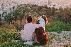 pet sitter with dog on mountain