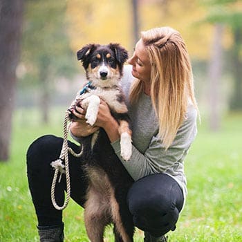 woman holding dog