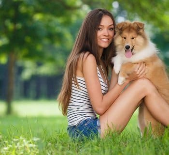 woman sitting with dog